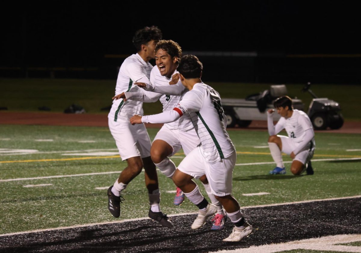 The COD men's team celebrates after scoring a goal. 