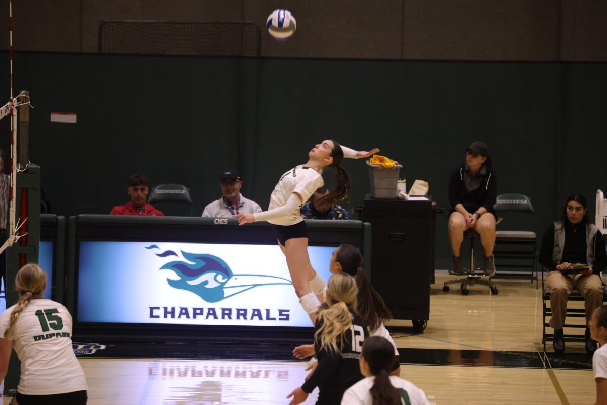 Freshman outside hitter Skylar Huffman spikes the ball. 