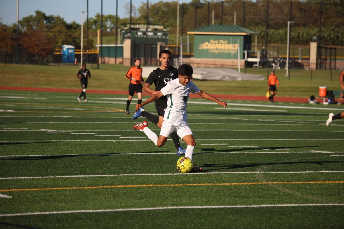 Freshman Alan Rivas kicks the ball. 