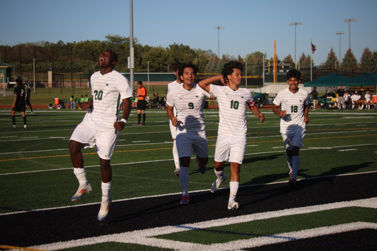 The COD soccer team celebrates after scoring a goal. 