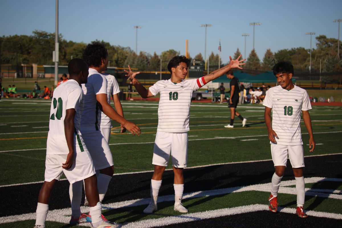 The COD soccer team celebrates after scoring a goal. 