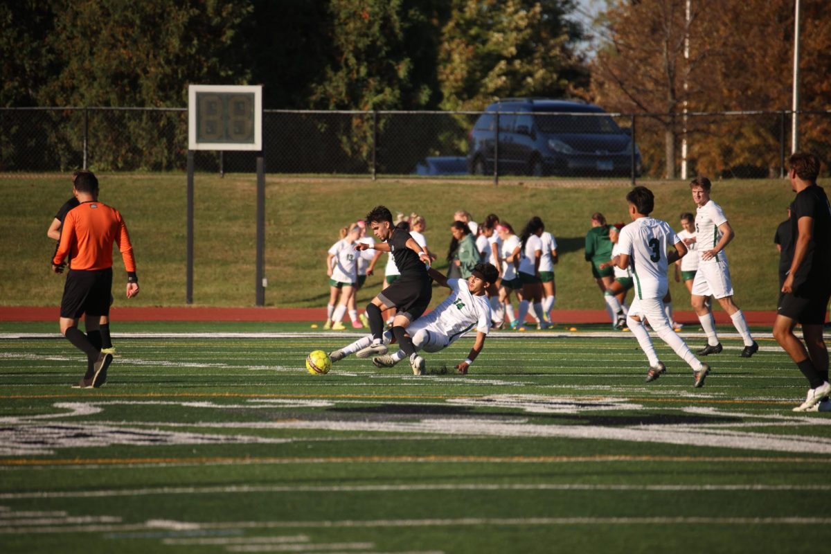 Freshman Luis Gutierrez slides to gain control of the ball. 