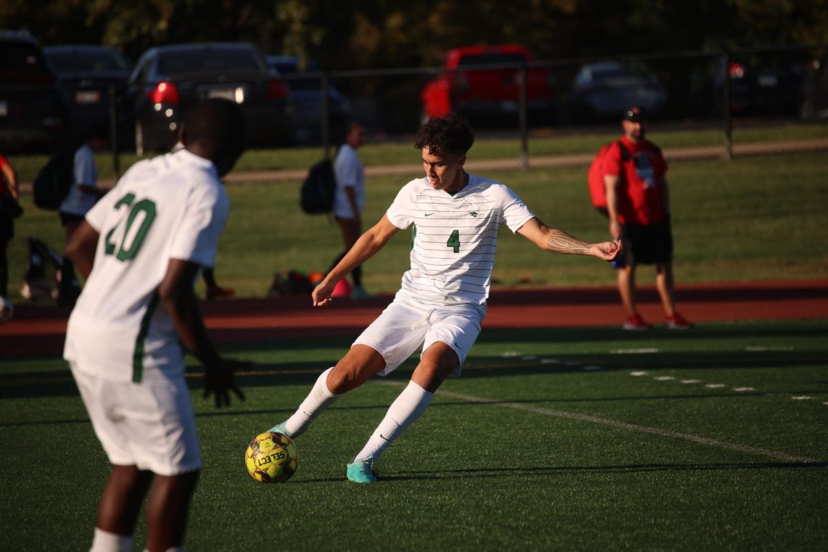 Freshman James Pita kicks the ball. 