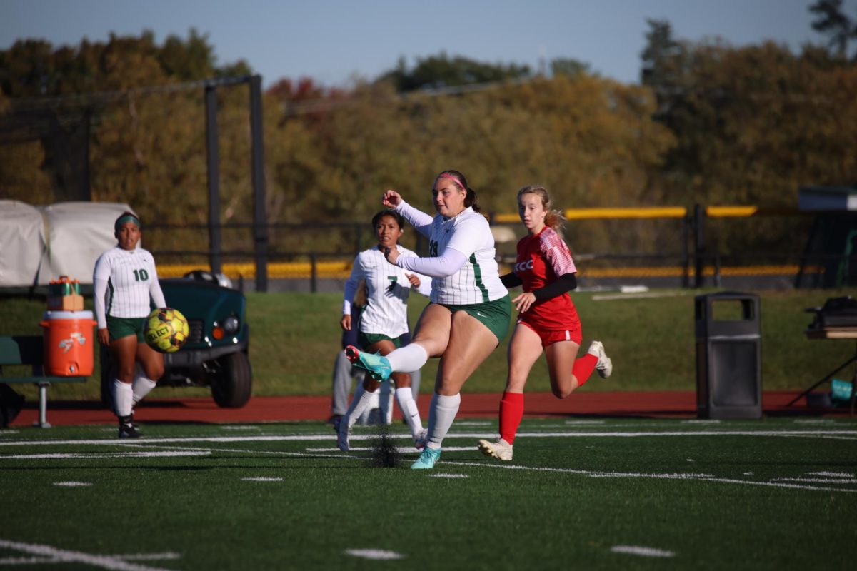 Freshman Elizabeth Kelsey passes the ball.