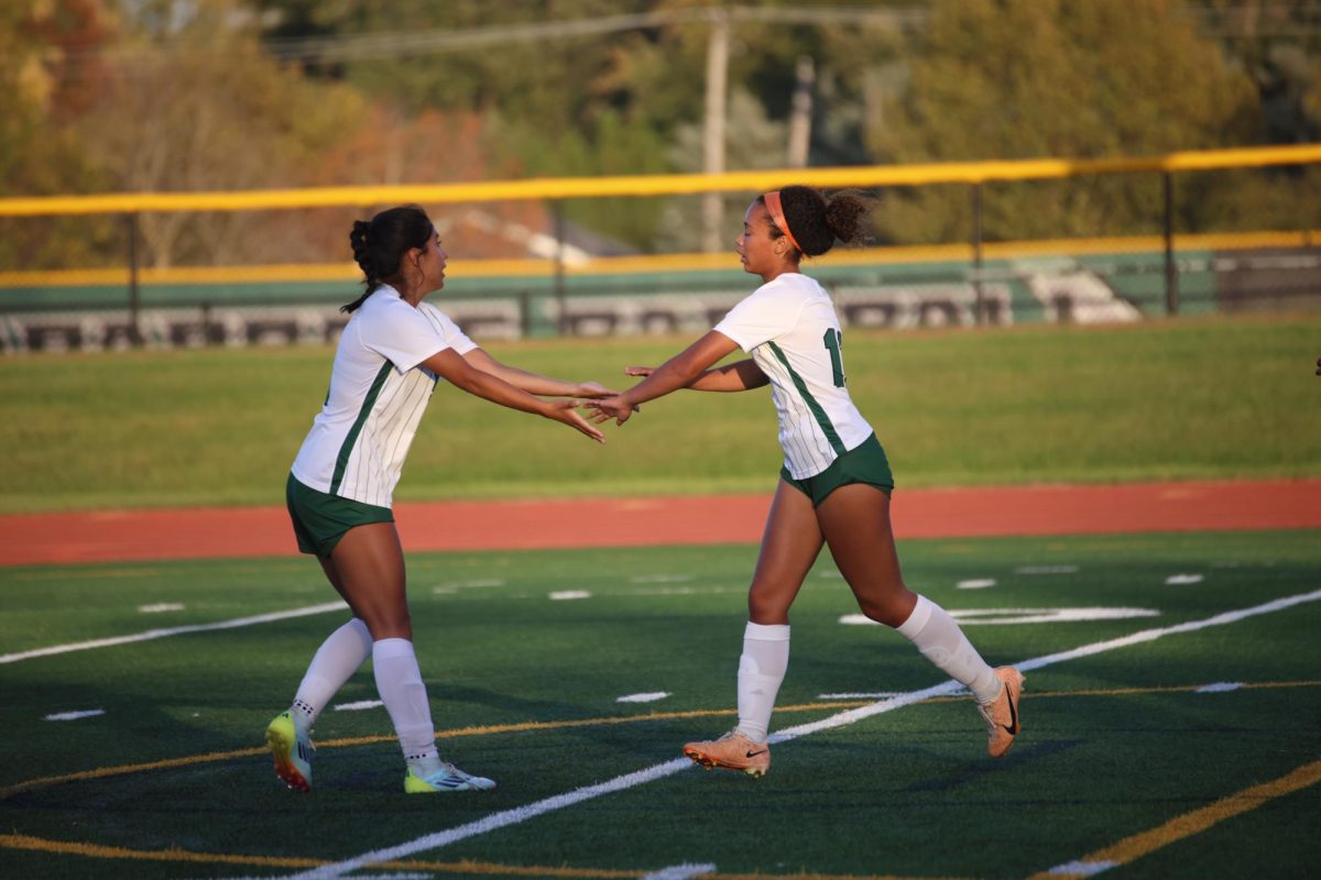 Asa Potts and Mariel Lara celebrate with each other after extending the Chaps' lead.