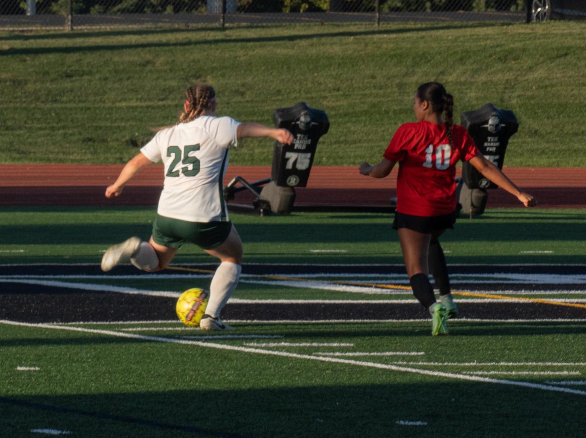 Number 25, Lucille Sugarman about to cross the ball.
