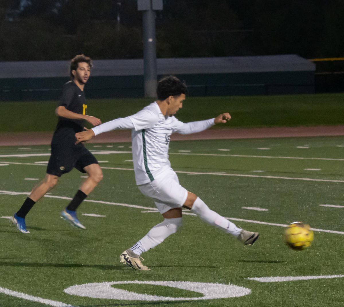 Number 14, Luis Gutierez passing the ball.