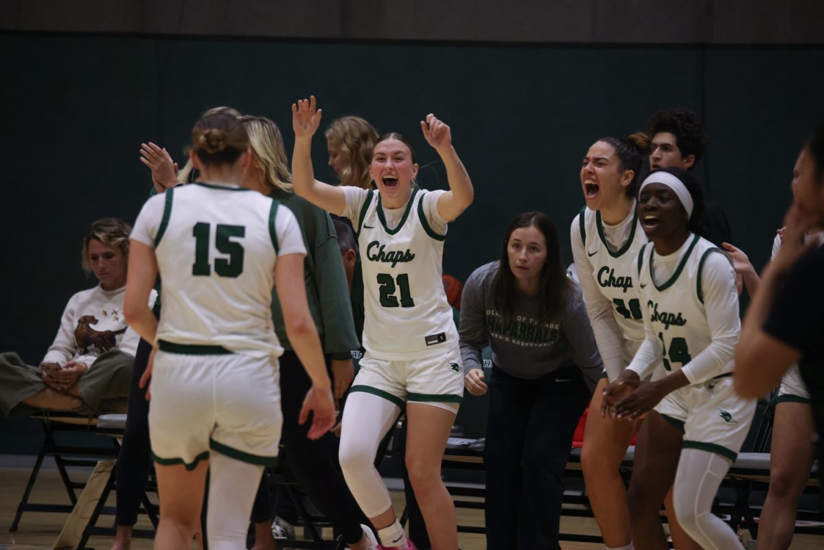 The COD women's basketball team cheers after scoring a point. 