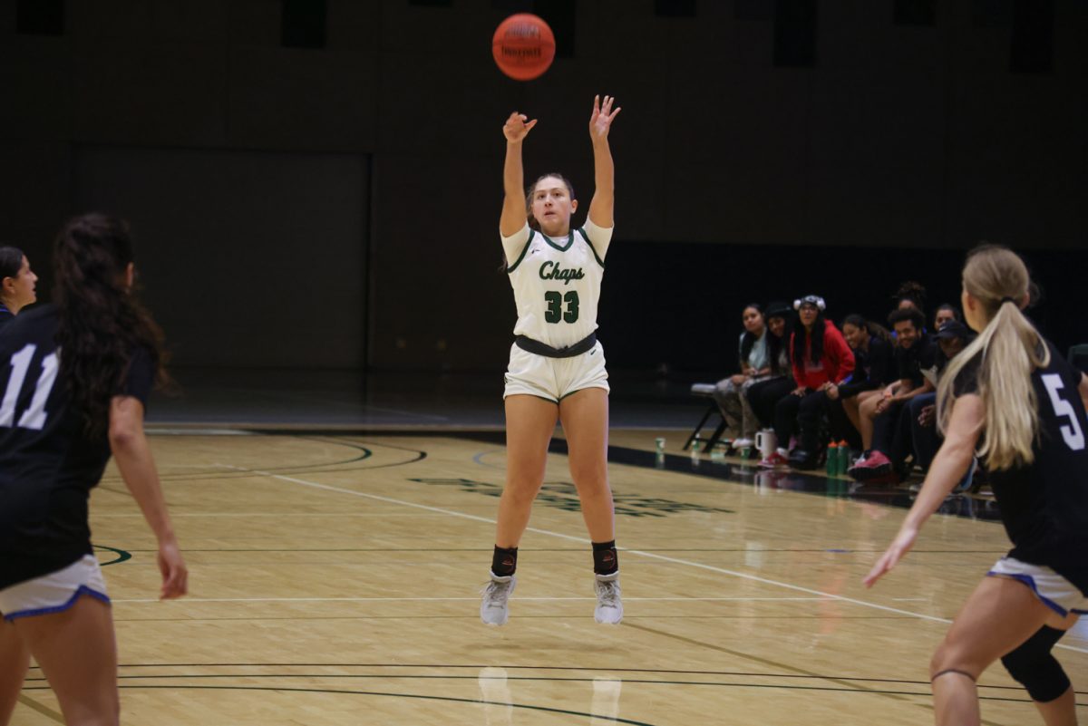 Freshman Madison Dubiel shoots a three point shot. 