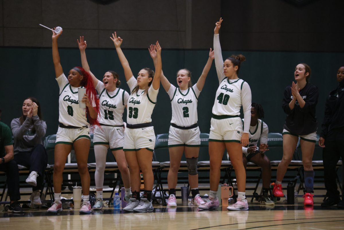 The COD women's basketball team cheers after scoring a point. 