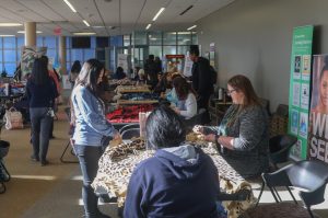 Students create blankets at Doers and Donors event on Tue, Dec. 3. 