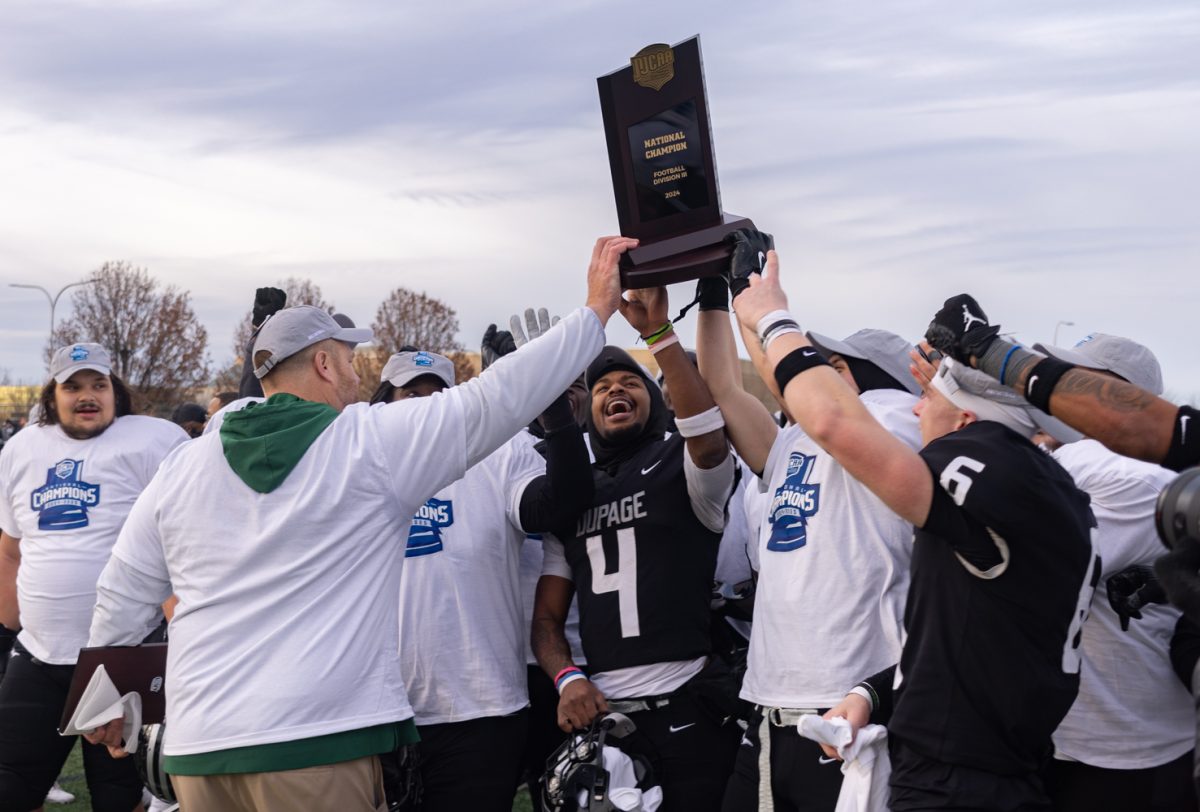 The COD football team celebrates after winning the national championship. 