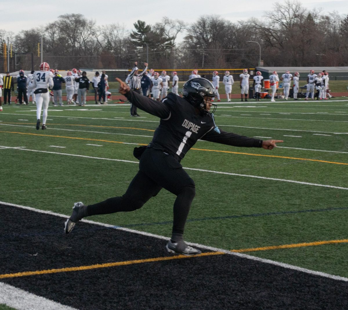 Freshman quarterback Justin Bland celebrates after scoring a touchdown. 