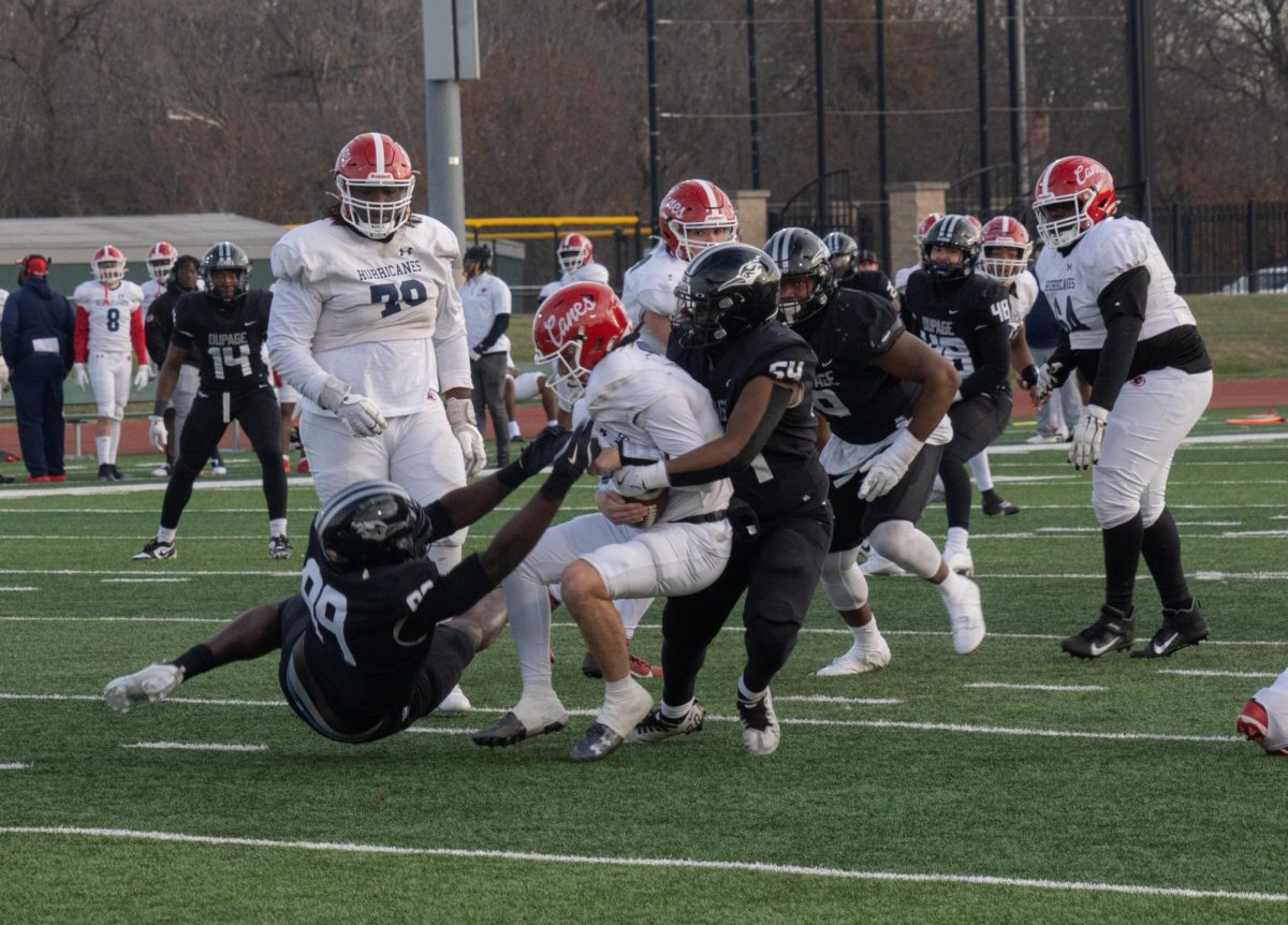 Sophomore defensive lineman Kenny Akintunde and sophomore defensive lineman Marques Boddie make a tackle. 