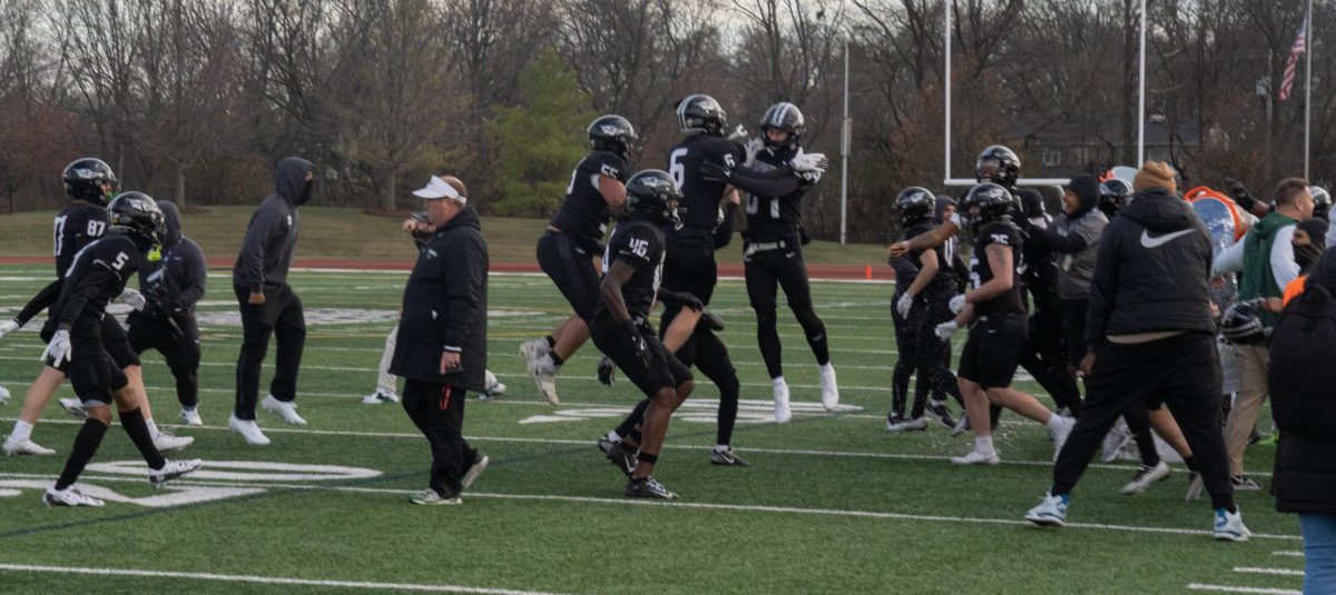 The COD football team celebrates after winning the national championship. 