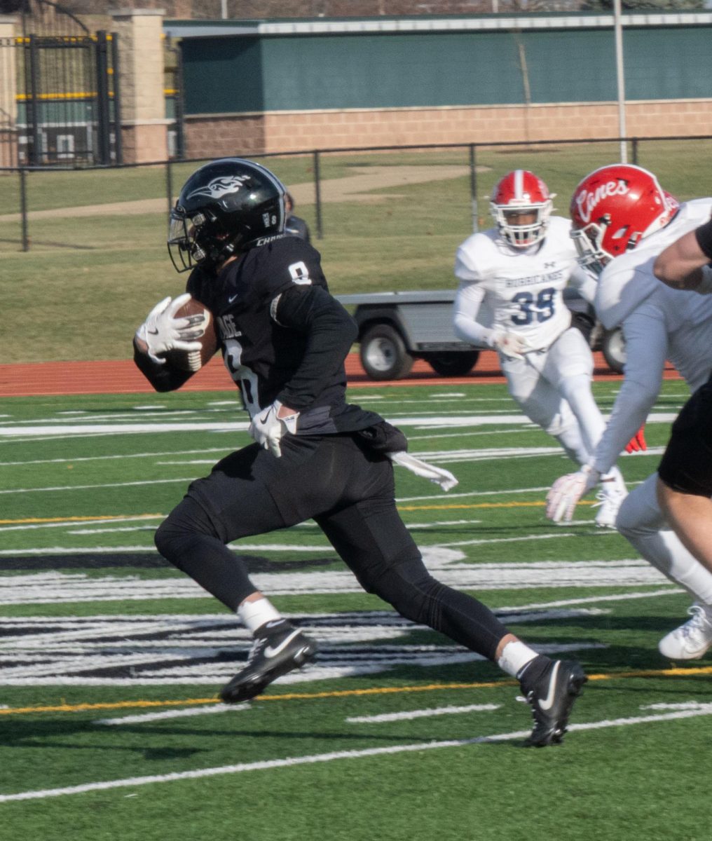 Freshman wide receiver Michael Cervantes breaks away from the Louisburg defense. 