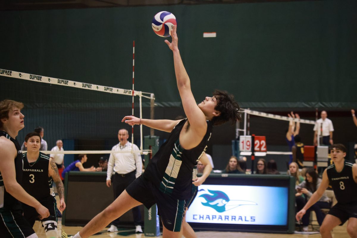 Freshman middle hitter Brayden Tejeda reaches back for the ball. 