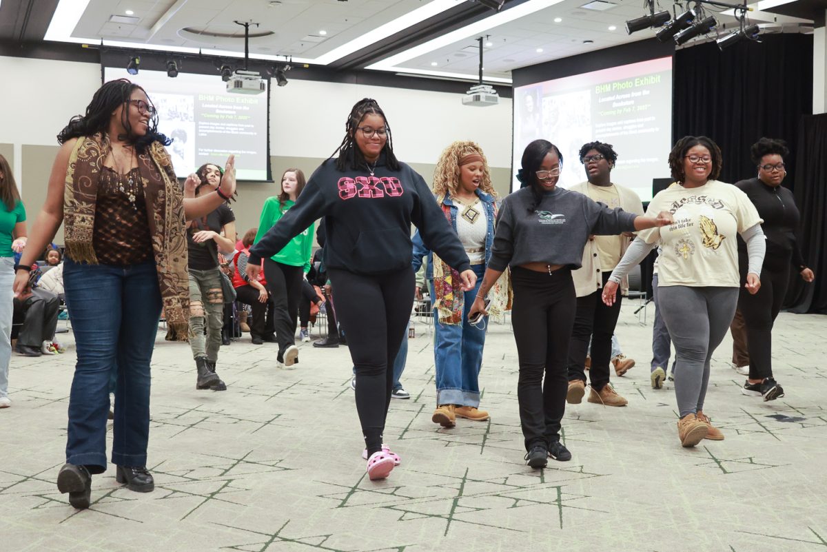 Students dance in the Black History Month opening ceremony.