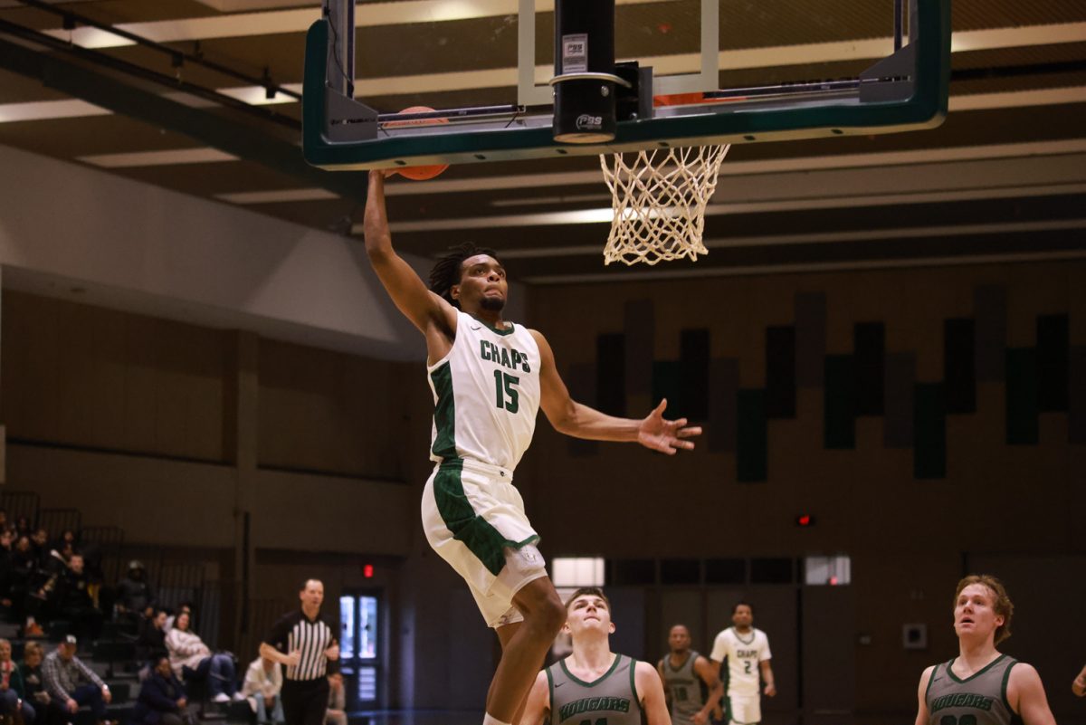 Sophomore forward Terence Spencer jumps to dunk the ball.