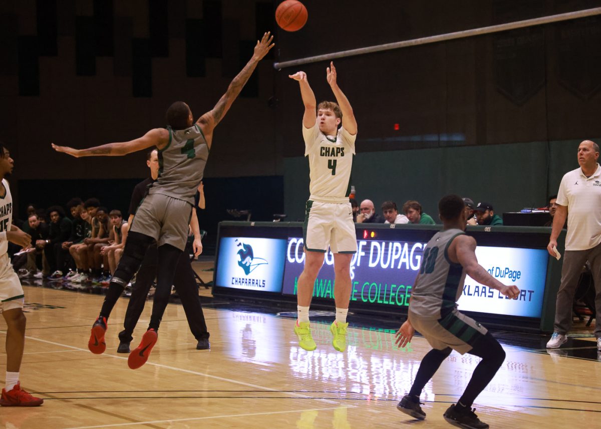 Sophomore guard Ben Zielinski shoots a three point shot. 