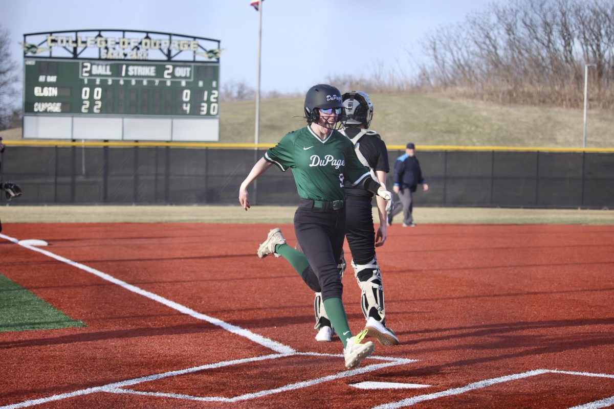 Freshman utility player Riley O'Neill crosses home plate after hitting an inside the park home run. 