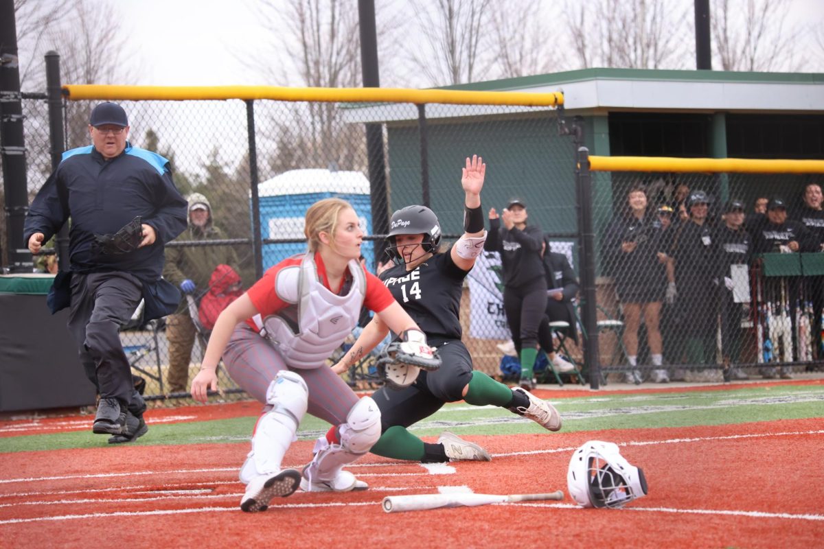 Sophomore infielder Raena Del Angel slides into home plate. 