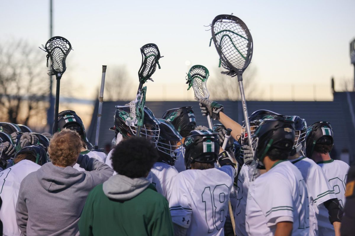 The College of DuPage men's lacrosse team huddles before the game. 