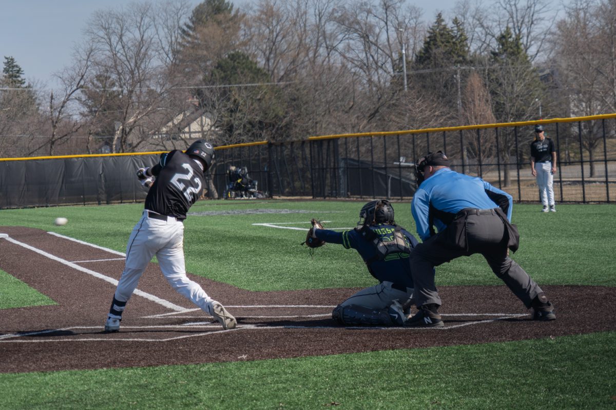 Number 22, Anthony Titone swinging at a pitch.