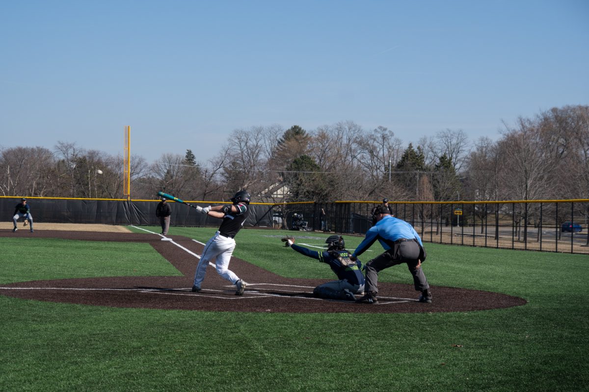Number 14, Zach Glidewell swinging.
