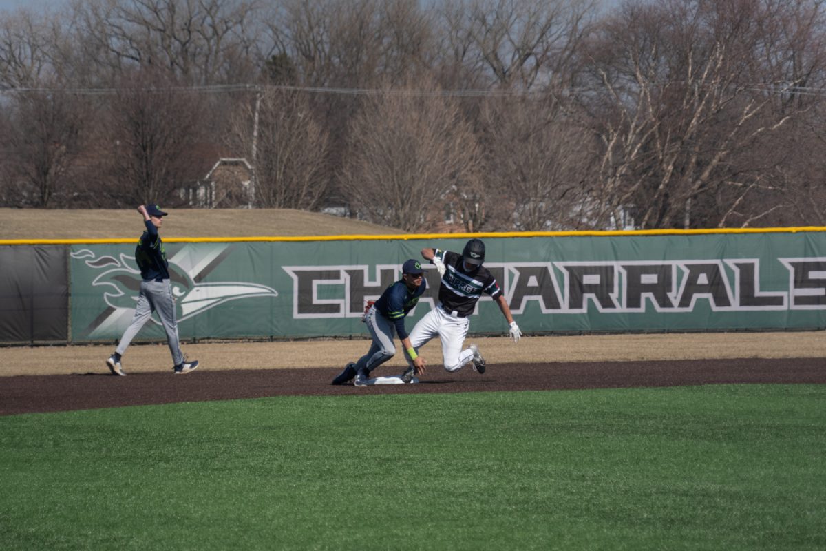 A player sliding into second base.