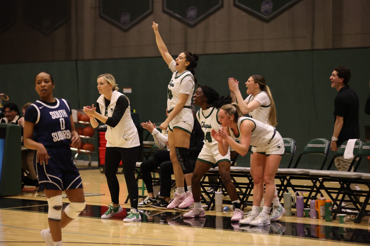 The COD women's basketball team celebrates after scoring.