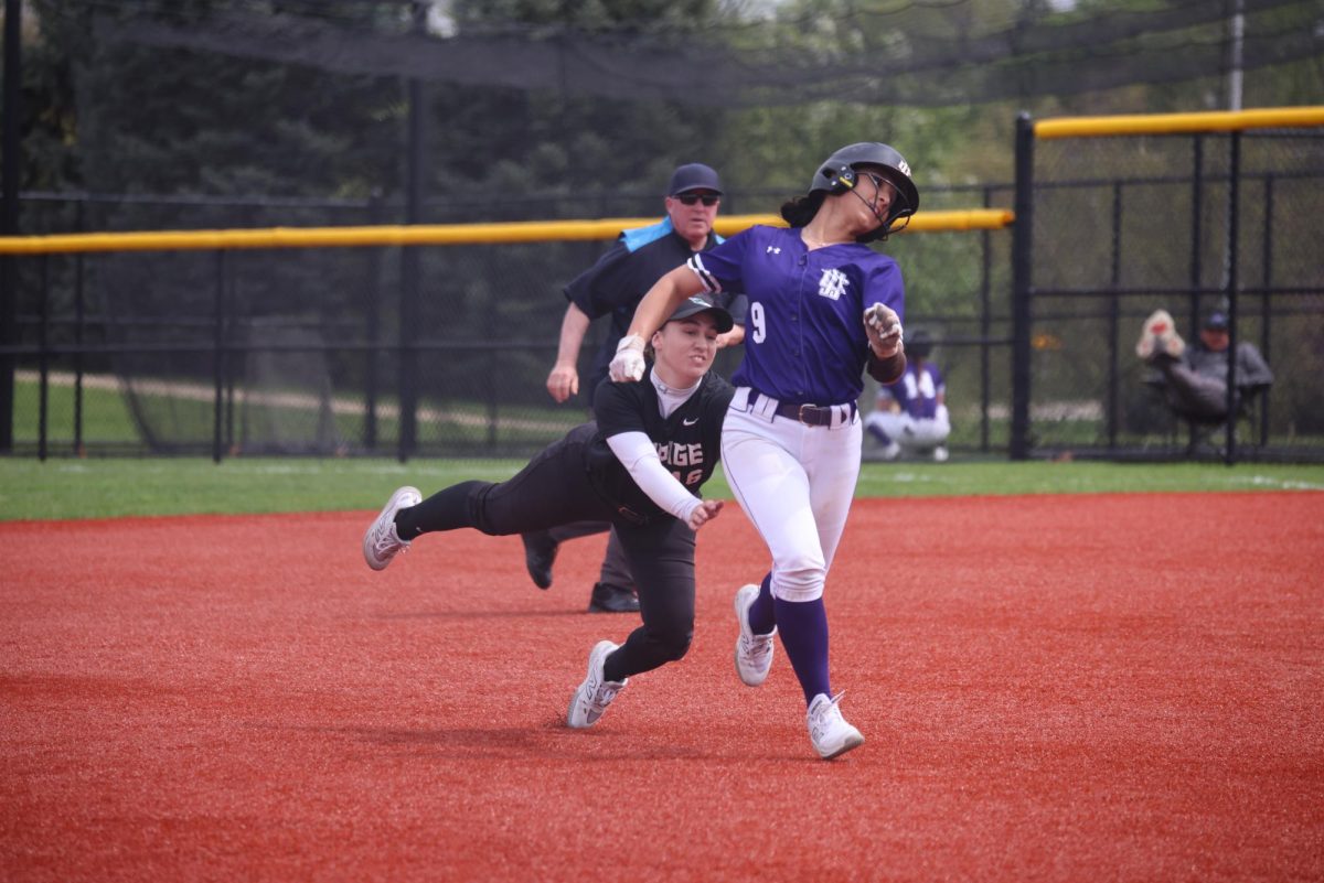 Addison Brandl tags the Joliet Junior College runner on a run down. 
