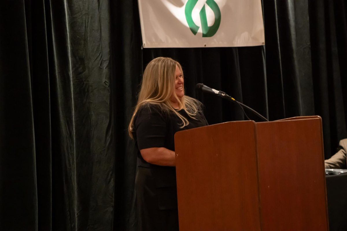 Kris Morton Holtquist speaking.
