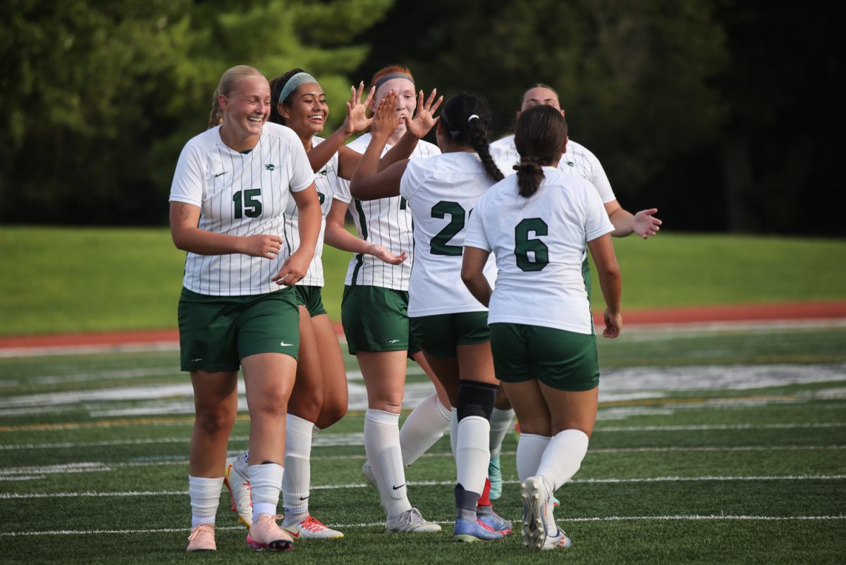 The College of DuPage women's soccer team celebrates after scoring a goal. 