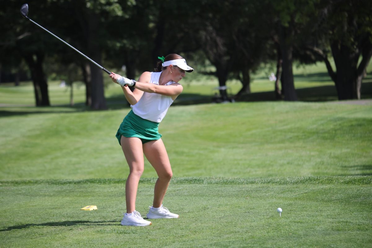 Aubreye Hyatt winds up her club before swinging the ball.