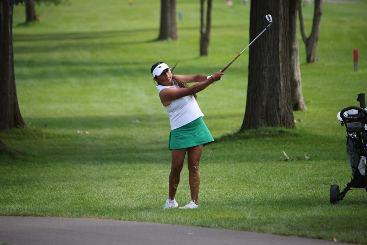 Liliana Martinez hits the ball. 

