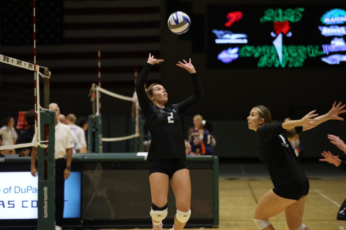 Sophomore Jaime Volz sets the ball. 