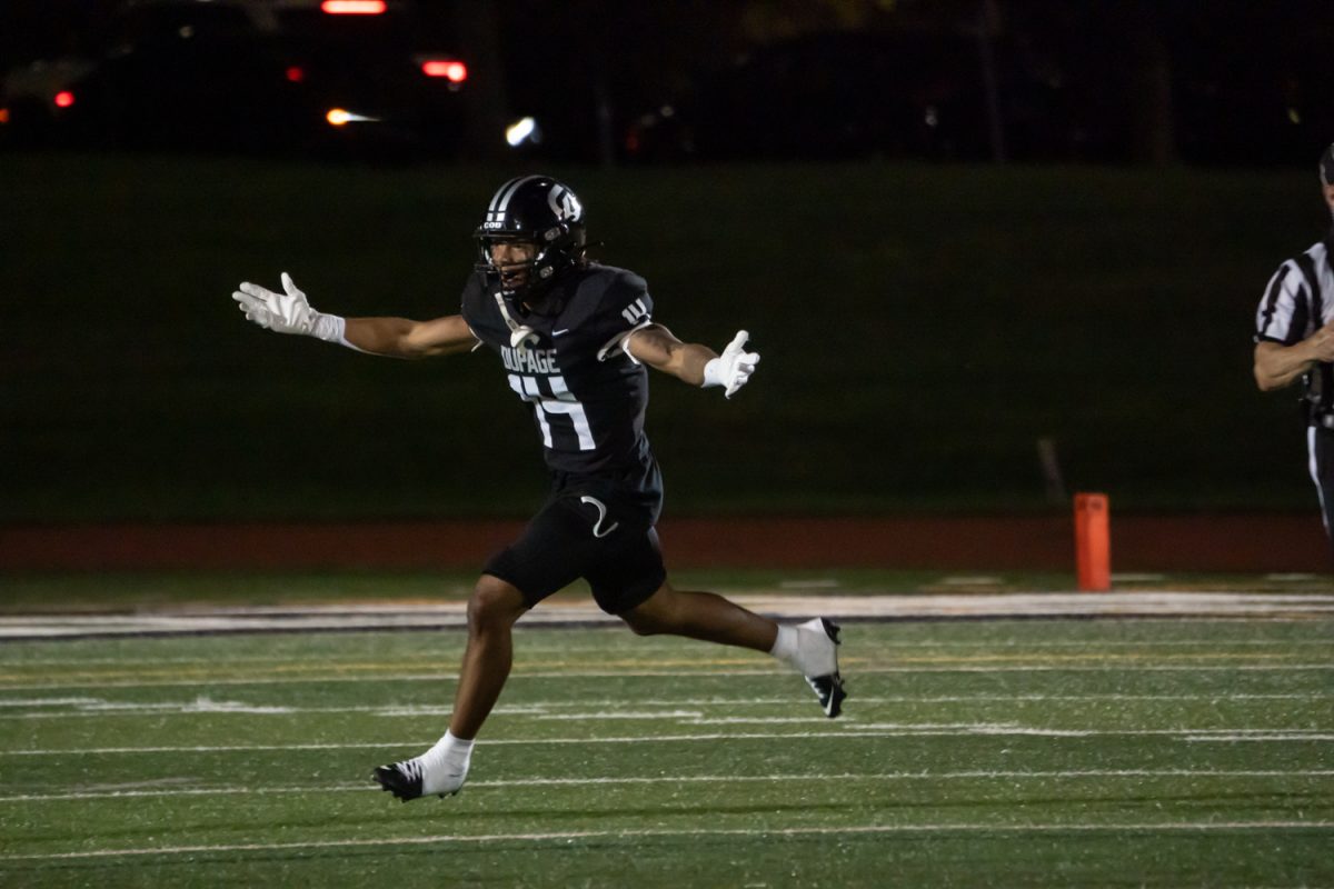 Number 14, Brandon Redmond celebrating after an interception.
