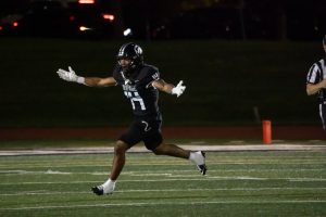 Number 14, Brandon Redmond celebrating after an interception.
