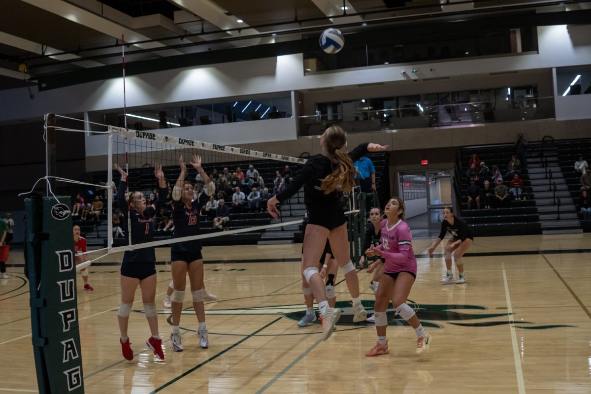 Number 3, Jamie Loftus jumping to spike the ball.
