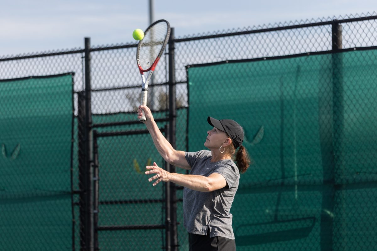 Kathy Johns serves.