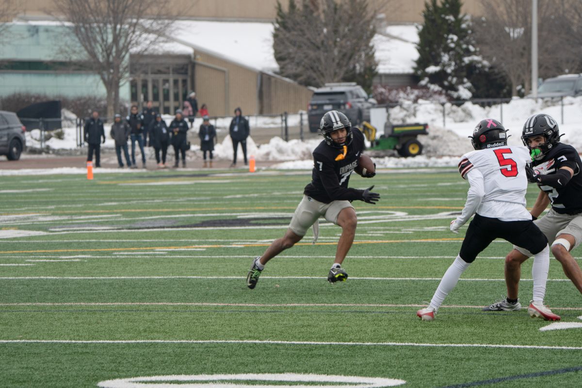 Askia Bullie carries the ball.
