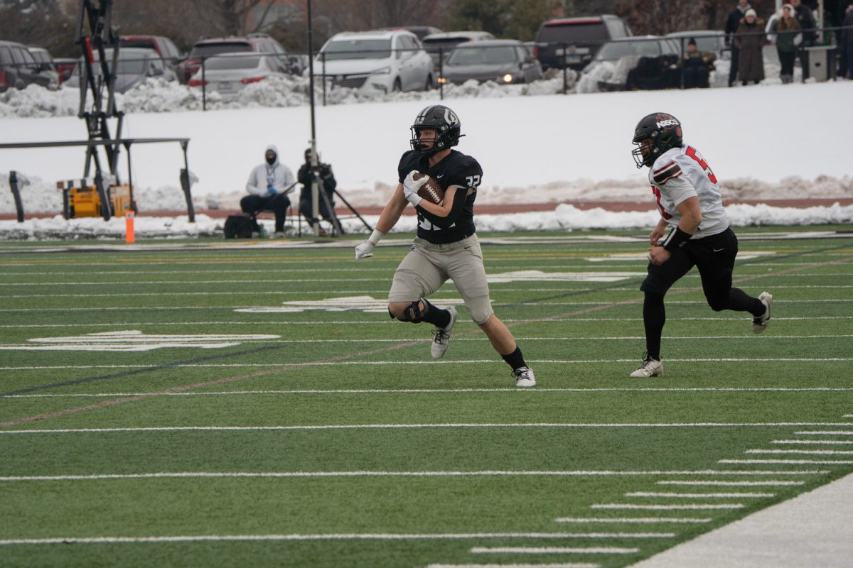 Haiden Janke carries the ball. 