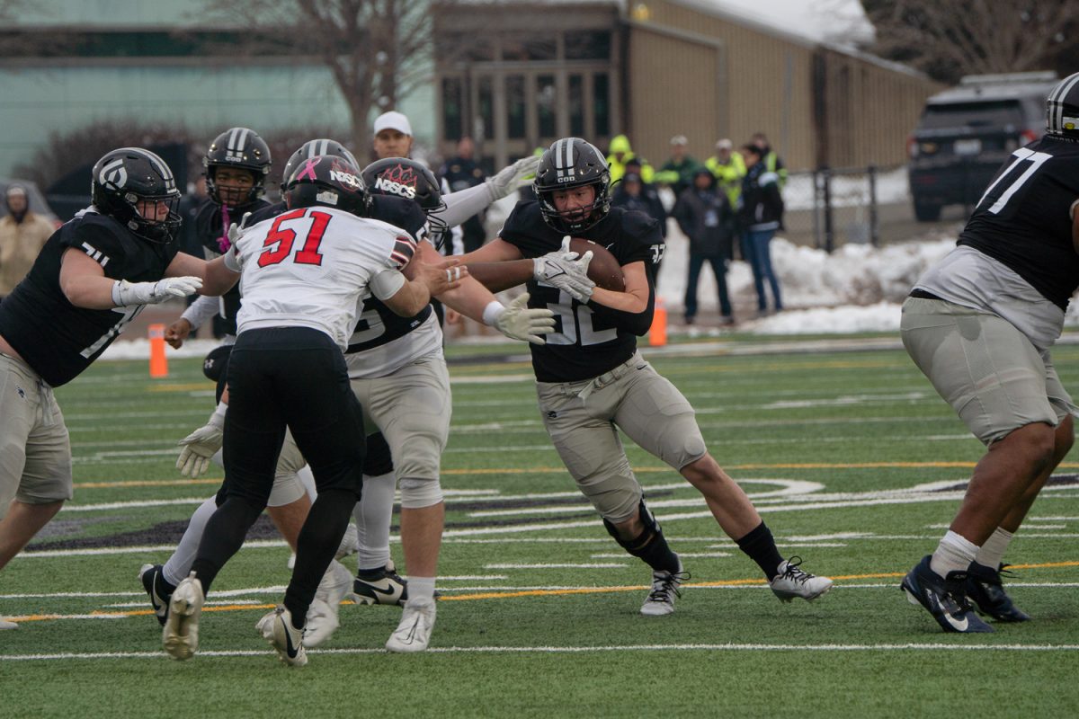 Haiden Janke carries the ball. 