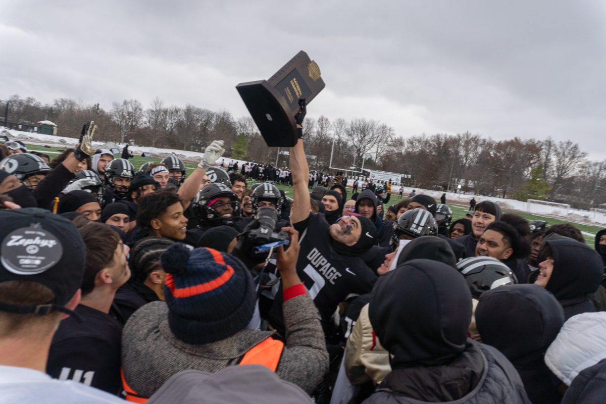 The College of DuPage football team celebrates after winning the national championship.