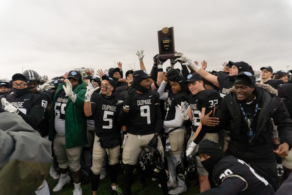 The College of DuPage football team celebrates after winning the national championship.