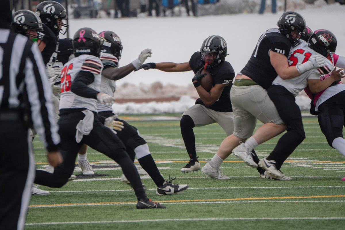 AJ Moore carries the ball.