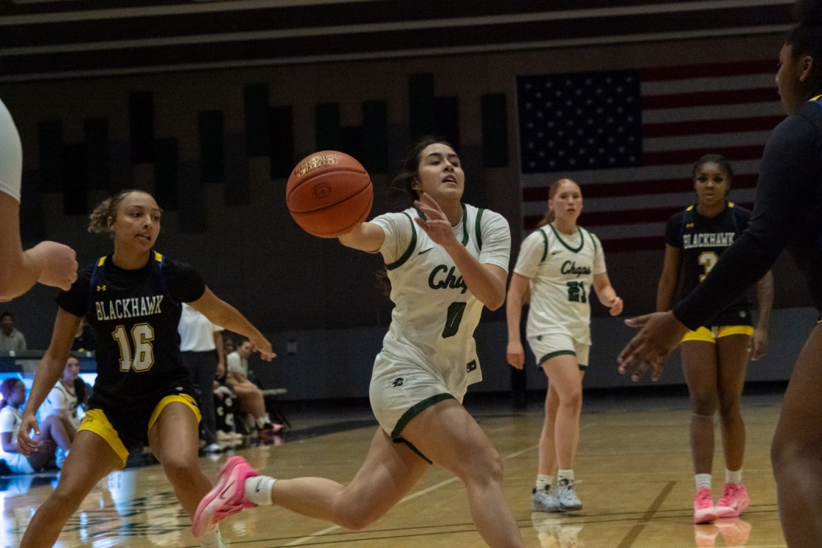 Number 0, Lexi Lopez about to pass the ball while on offense.