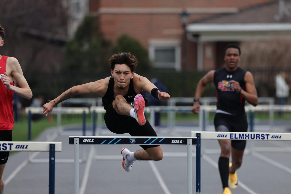 Hassel Colula competes in the 400-meter high hurdles.