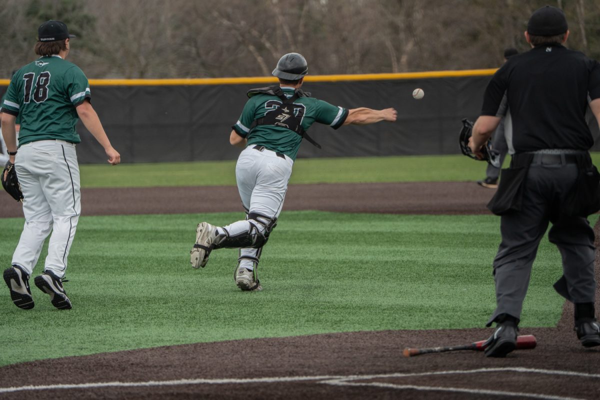 Number 20, Rocco Damato throwing the ball to first.
